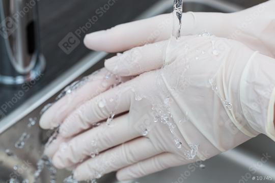 Dentist helper Washing hands with One-time gloves  : Stock Photo or Stock Video Download rcfotostock photos, images and assets rcfotostock | RC Photo Stock.: