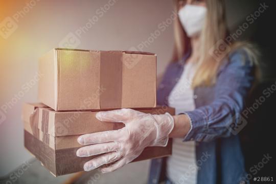 Dispatch postman bring parcels and post in covid 19 quarantine to the front home door with a face mask ffp 2 and protection gloves  : Stock Photo or Stock Video Download rcfotostock photos, images and assets rcfotostock | RC Photo Stock.: