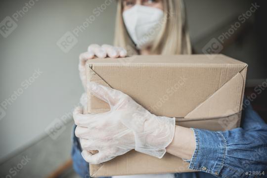 Dispatch postman bring parcels and post in covid 19 quarantine to the front home door with a face mask ffp2 and protection gloves  : Stock Photo or Stock Video Download rcfotostock photos, images and assets rcfotostock | RC Photo Stock.: