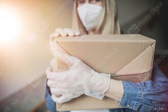 Dispatch postman bring parcels and post in covid 19 quarantine to the front home door with a face mask ffp2 and protection gloves  : Stock Photo or Stock Video Download rcfotostock photos, images and assets rcfotostock | RC Photo Stock.: