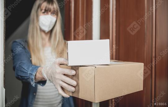 Dispatch postman bring parcels and post in covid 19 quarantine to the front home door with a face mask ffp2 and protection gloves  : Stock Photo or Stock Video Download rcfotostock photos, images and assets rcfotostock | RC Photo Stock.: