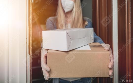 Dispatch postman bring parcels and post in covid 19 quarantine to the front home door with a face mask ffp2 and protection gloves  : Stock Photo or Stock Video Download rcfotostock photos, images and assets rcfotostock | RC Photo Stock.: