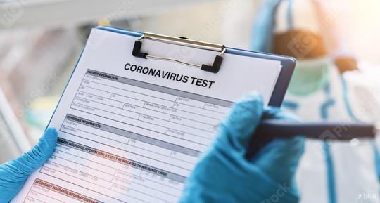Doctor fills out a coronavirus test data sheet with pen for a patient in protective clothing in a clinic leaning at Covid-19 coronavirus epidemic  : Stock Photo or Stock Video Download rcfotostock photos, images and assets rcfotostock | RC Photo Stock.: