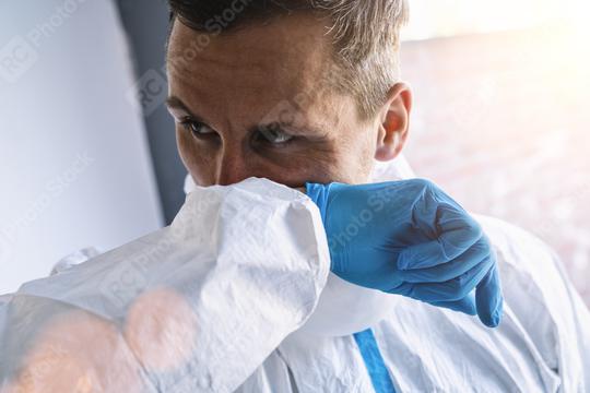 Doctor in clinic with protective clothing s coughs in his elbow at coronavirus covid-19 epidemic. Concept of stop spread of the virus.  : Stock Photo or Stock Video Download rcfotostock photos, images and assets rcfotostock | RC Photo Stock.: