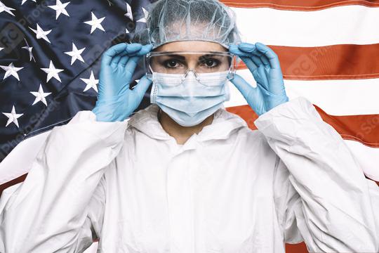 Doctor or Nurse Wearing Medical Personal Protective Equipment (PPE) Against The American Flag Banner.  : Stock Photo or Stock Video Download rcfotostock photos, images and assets rcfotostock | RC Photo Stock.: