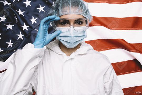 Doctor or Nurse Wearing Medical Personal Protective Equipment (PPE) Against The American Flag Banner.  : Stock Photo or Stock Video Download rcfotostock photos, images and assets rcfotostock | RC Photo Stock.: