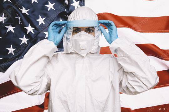 Doctor or Nurse Wearing Medical Personal Protective Equipment (PPE) with protective shield, Against The American Flag Banner. prevent corona COVID-19 and SARS infection concept image  : Stock Photo or Stock Video Download rcfotostock photos, images and assets rcfotostock | RC Photo Stock.: