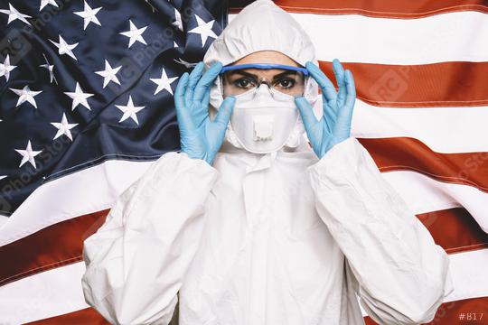 Doctor or Nurse Wearing Medical Personal Protective Equipment (PPE) Against The American Flag Banner. prevent corona COVID-19 and SARS infection concept image  : Stock Photo or Stock Video Download rcfotostock photos, images and assets rcfotostock | RC Photo Stock.: