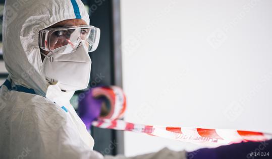 Doctor seals off contaminated area with barrier tape during coronavirus (Coivd-19) epidemic in a clinic at the  intensive care unit  : Stock Photo or Stock Video Download rcfotostock photos, images and assets rcfotostock | RC Photo Stock.: