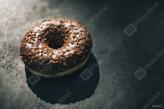 donut with chocolate glazed and sprinkles on a dark table  : Stock Photo or Stock Video Download rcfotostock photos, images and assets rcfotostock | RC Photo Stock.: