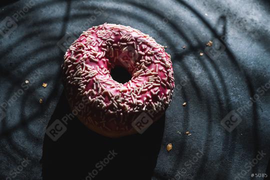 donut with pink glazed and sprinkles and Baking grid shadow  : Stock Photo or Stock Video Download rcfotostock photos, images and assets rcfotostock | RC Photo Stock.: