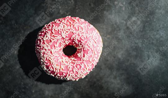 donut with pink glazed and sprinkles on a dark table  : Stock Photo or Stock Video Download rcfotostock photos, images and assets rcfotostock | RC Photo Stock.: