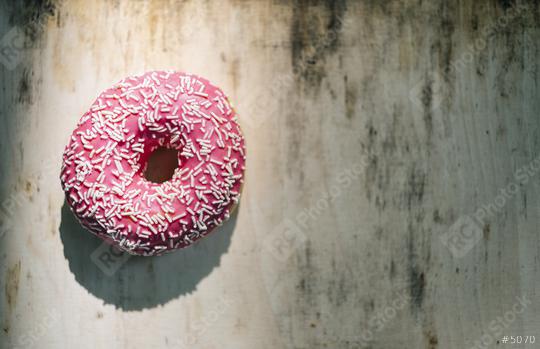 donut with pink glazed and sprinkles on a wooden table, including Copy space  : Stock Photo or Stock Video Download rcfotostock photos, images and assets rcfotostock | RC Photo Stock.:
