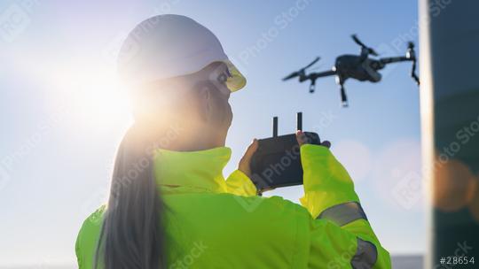 Drone inspection. Female Operator inspecting Wind turbine with d  : Stock Photo or Stock Video Download rcfotostock photos, images and assets rcfotostock | RC Photo Stock.: