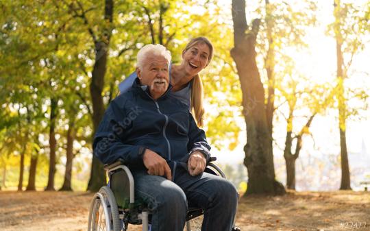 Elderly man in a wheel chair and a nurse enjoying a sunny day in the park, both smiling and looking happy  : Stock Photo or Stock Video Download rcfotostock photos, images and assets rcfotostock | RC Photo Stock.: