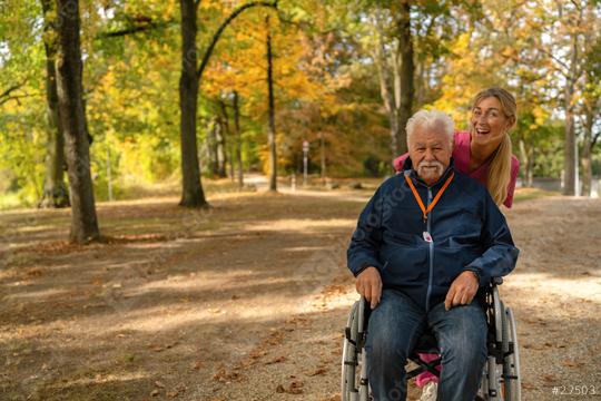 Elderly man in wheelchair wearing SOS button, with nurse in park during autumn   : Stock Photo or Stock Video Download rcfotostock photos, images and assets rcfotostock | RC Photo Stock.: