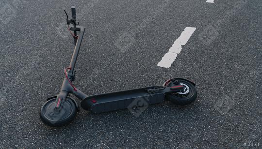 electric scooter or e-scooter lies on the road after a accident, Electric urban transportation concept image   : Stock Photo or Stock Video Download rcfotostock photos, images and assets rcfotostock | RC Photo Stock.: