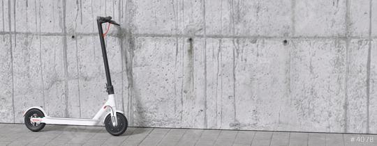 Electric scooter or e-scooter on wall for mobility in the city  : Stock Photo or Stock Video Download rcfotostock photos, images and assets rcfotostock | RC-Photo-Stock.:
