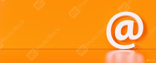 Email Icon or at sign leaning against a orange wall as a communication concept, copyspace for your individual text.  : Stock Photo or Stock Video Download rcfotostock photos, images and assets rcfotostock | RC Photo Stock.: