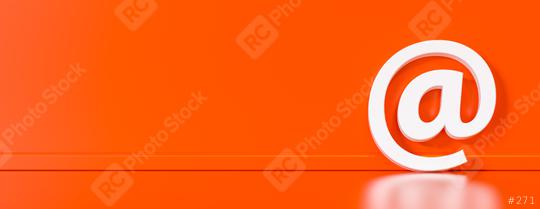 Email Icon or at sign leaning against a red wall as a communicat  : Stock Photo or Stock Video Download rcfotostock photos, images and assets rcfotostock | RC Photo Stock.: