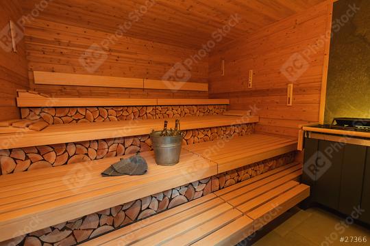 Empty finnish sauna room with wooden benches and walls, sauna stones heater, bucket, and ladle and  felt hats. Wellness Spa Hotel Conept image.  : Stock Photo or Stock Video Download rcfotostock photos, images and assets rcfotostock | RC Photo Stock.: