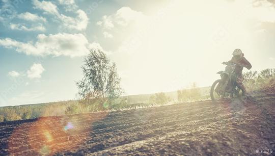 Enduro racer on dirt track on his Motocross MX cycle at sunset  : Stock Photo or Stock Video Download rcfotostock photos, images and assets rcfotostock | RC Photo Stock.: