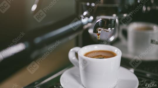 Espresso out of classic coffee machine into coffee cup  : Stock Photo or Stock Video Download rcfotostock photos, images and assets rcfotostock | RC Photo Stock.: