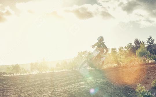 Extreme Motocross MX racer accelerating in dirt track at bright sunset  : Stock Photo or Stock Video Download rcfotostock photos, images and assets rcfotostock | RC Photo Stock.: