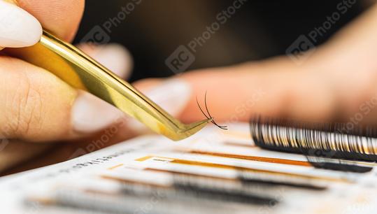 Eyelashes. Close-up tool for eyelash extension. Cosmetician takes Eyelashes with tweezers at  cosmetology salon. Lashes, close up, Eyelash Extension Procedure concept image  : Stock Photo or Stock Video Download rcfotostock photos, images and assets rcfotostock | RC Photo Stock.: