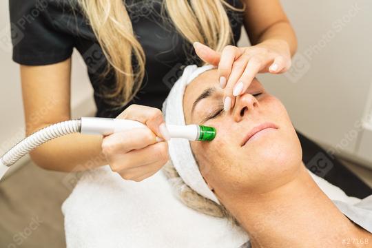 Face of a beautiful pleasant woman being cleansed during aquafacial procedure at a  cosmetology salon.   : Stock Photo or Stock Video Download rcfotostock photos, images and assets rcfotostock | RC Photo Stock.: