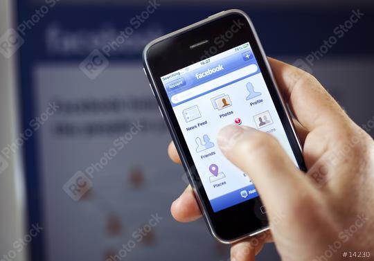 Facebook app in front of Facebook  : Stock Photo or Stock Video Download rcfotostock photos, images and assets rcfotostock | RC Photo Stock.:
