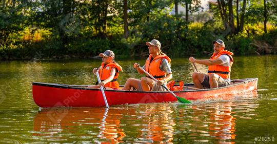 family canoeing on a river at summer mother and daughter paddling at front, father at the back in germany. Family on kayak ride. Wild nature and water fun on summer vacation.  : Stock Photo or Stock Video Download rcfotostock photos, images and assets rcfotostock | RC Photo Stock.: