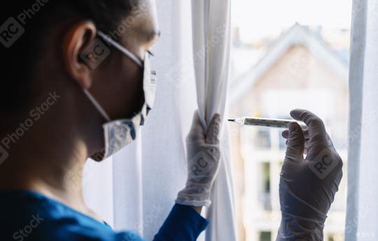 fearful and  infection woman in corona quarantine looking out of window to a  clinical thermometer - stay at home  : Stock Photo or Stock Video Download rcfotostock photos, images and assets rcfotostock | RC Photo Stock.: