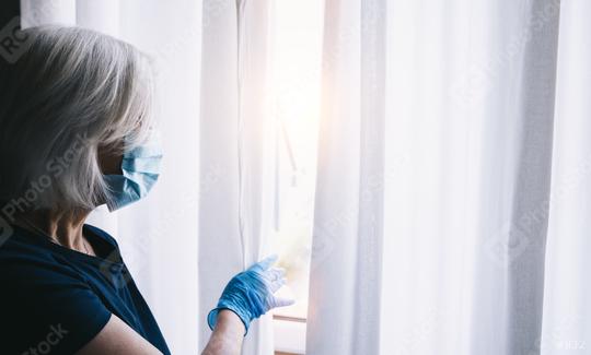 fearful senior woman in corona COVID-19 quarantine looking out of window to the street  : Stock Photo or Stock Video Download rcfotostock photos, images and assets rcfotostock | RC Photo Stock.: