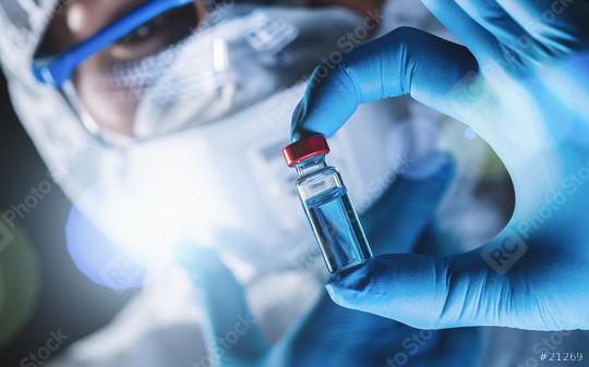 Female biologist holding bottle with new coronavirus, covid-19 vaccine,  : Stock Photo or Stock Video Download rcfotostock photos, images and assets rcfotostock | RC Photo Stock.: