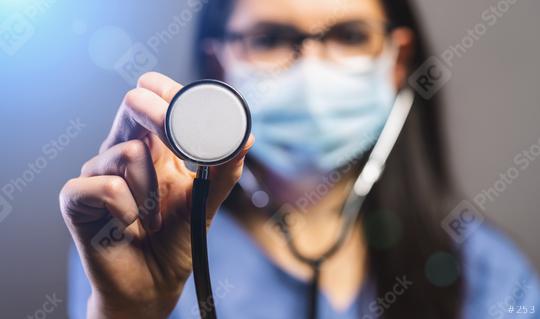 female doctor in protective mask holding stethoscope and looking at camera. Concept medicine image, level of medicine, virus, epidemic corona or covid-19  : Stock Photo or Stock Video Download rcfotostock photos, images and assets rcfotostock | RC Photo Stock.: