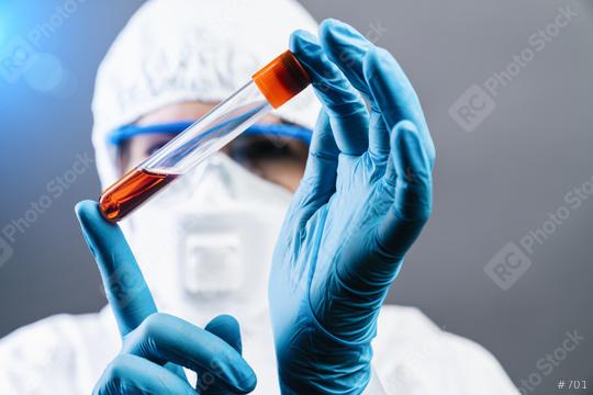 Female doctor or Scientist holds Invented red vaccine against covid 19 or Coronavirus  : Stock Photo or Stock Video Download rcfotostock photos, images and assets rcfotostock | RC Photo Stock.: