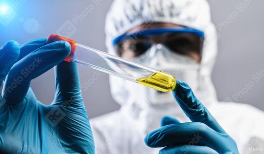 Female doctor or Scientist holds Invented yellow vaccine against covid 19 or Coronavirus  : Stock Photo or Stock Video Download rcfotostock photos, images and assets rcfotostock | RC Photo Stock.: