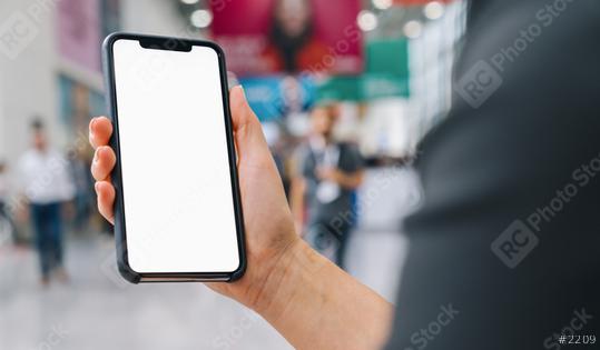 Female hand holding black cellphone with white screen at a trade fair, copyspace for your individual text.  : Stock Photo or Stock Video Download rcfotostock photos, images and assets rcfotostock | RC Photo Stock.: