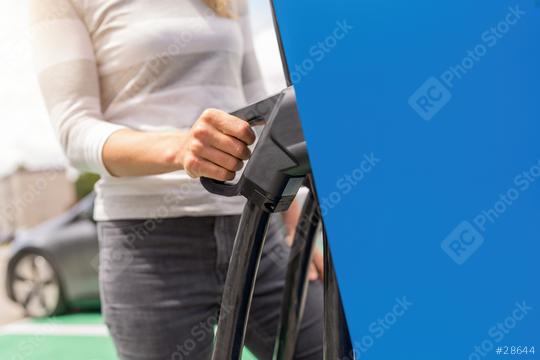 Female hand holding fast charging socket DC - CCS type 2 EV. Com  : Stock Photo or Stock Video Download rcfotostock photos, images and assets rcfotostock | RC Photo Stock.: