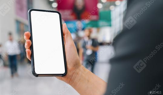 Female hand of a business woman holding black cellphone with white screen at a trade fair, copyspace for your individual text.  : Stock Photo or Stock Video Download rcfotostock photos, images and assets rcfotostock | RC Photo Stock.: