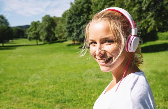 Female Runner Jogging during Outdoor Workout in a Park with headphones. copyspace for your individual text.  : Stock Photo or Stock Video Download rcfotostock photos, images and assets rcfotostock | RC Photo Stock.: