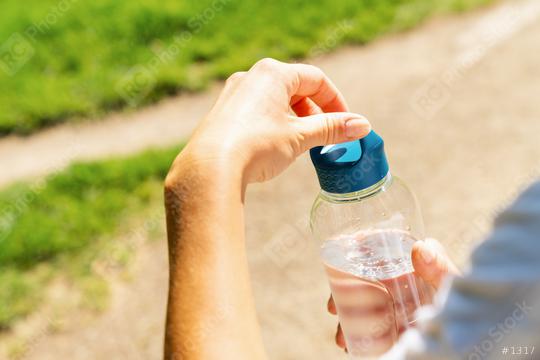 Female runner open bottle of water. healthy lifestyle fitness sport concept image  : Stock Photo or Stock Video Download rcfotostock photos, images and assets rcfotostock | RC Photo Stock.: