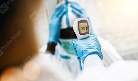 Fevers measure forehead by infrared in Covid-19 patient in a clinic during coronavirus epidemic  : Stock Photo or Stock Video Download rcfotostock photos, images and assets rcfotostock | RC Photo Stock.: