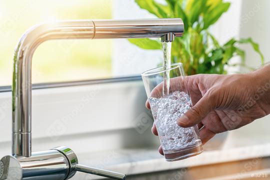 Filling glass of water from stainless steel kitchen faucet  : Stock Photo or Stock Video Download rcfotostock photos, images and assets rcfotostock | RC-Photo-Stock.: