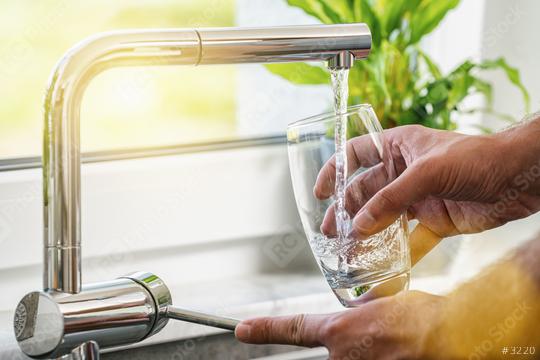 Filling glass of water from stainless steel kitchen faucet  : Stock Photo or Stock Video Download rcfotostock photos, images and assets rcfotostock | RC Photo Stock.: