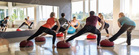 Fitness class participants doing side lunges on Bosu Balls in a sunny room  : Stock Photo or Stock Video Download rcfotostock photos, images and assets rcfotostock | RC Photo Stock.: