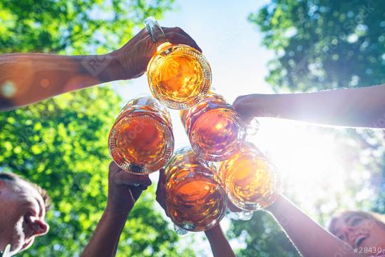 Five friends, men and women, having fun in beer garden clinking glasses with beer in a Beer garden, Munich, Germany  : Stock Photo or Stock Video Download rcfotostock photos, images and assets rcfotostock | RC Photo Stock.: