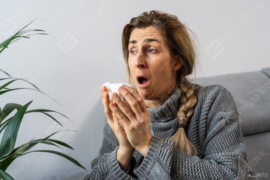 Flu. woman got nose allergy, flu sneezing nose sitting at the sofa at home.  : Stock Photo or Stock Video Download rcfotostock photos, images and assets rcfotostock | RC Photo Stock.: