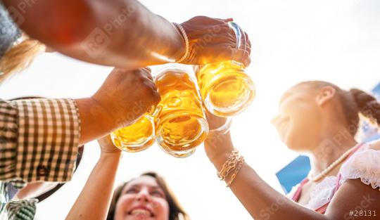 Four friends, men and women, having fun in beer garden clinking glasses with beer at Oktoberfest or Dult in germany  : Stock Photo or Stock Video Download rcfotostock photos, images and assets rcfotostock | RC Photo Stock.: